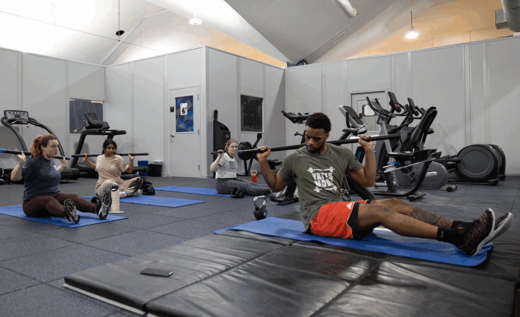 Man leading small group through workout